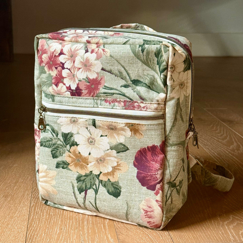 Floral-patterned bag on a wooden surface
